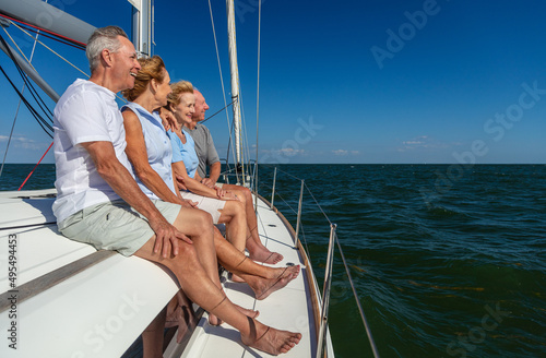 Retired friends enjoying carefree travel on luxury yacht © Spotmatik