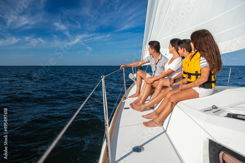 Adventurous young Latin American family on luxury yacht © Spotmatik