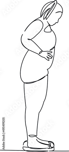 fat woman weighing herself on the scales
