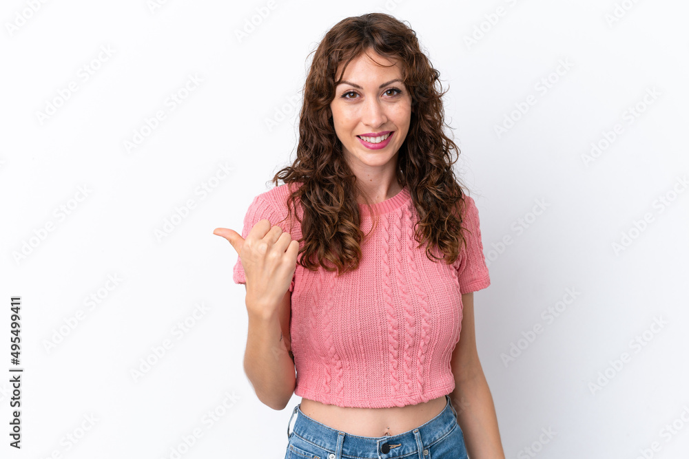 Young woman with curly hair isolated on white background pointing to the side to present a product Young woman with curly hair isolated on white background pointing to the side to present a product