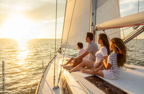 Sailing at sunset Hispanic family enjoying carefree vacation © Spotmatik