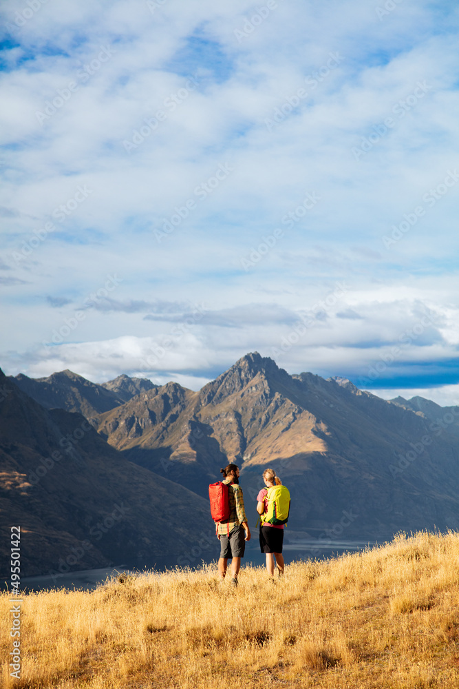 Couple on hiking holiday New Zealand Lake Wakatipu
