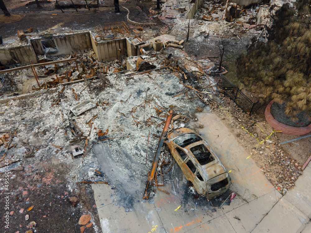 remnants of a burned home and car from a destructive urban wildfire Marshall Fire due to Climate Change remnants of a burned home and car from a destructive urban wildfire Marshall Fire due to Climate Change