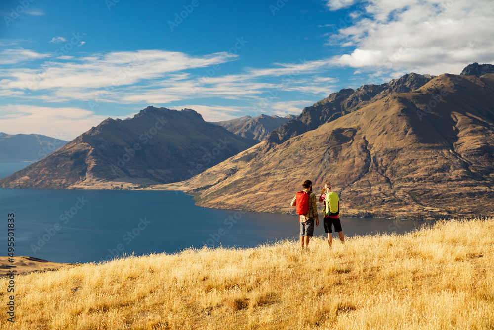 Young hikers viewing Landscape Lake Wakatipu New Zealand