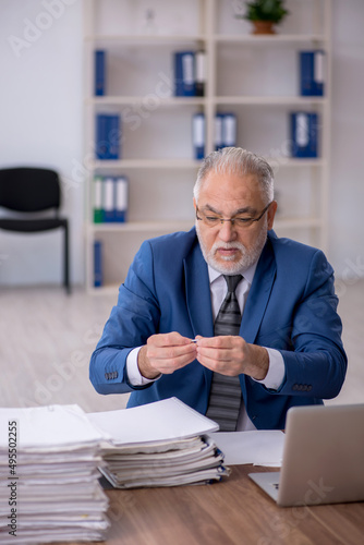 Old male employee and too much work in the office