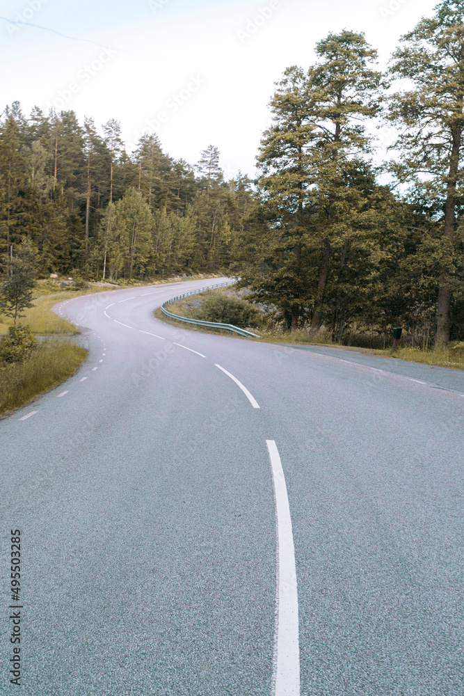 Empty winding country road Empty winding country road