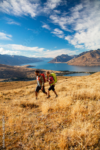New Zealand Male female hikers trekking The Remarkables