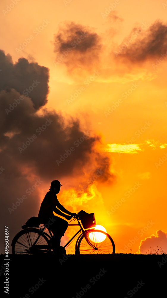 silhouette of a bike on sunset