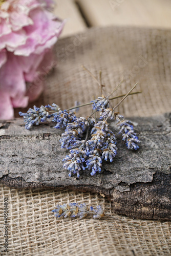  Dry lavender flowers on the wooden background. 