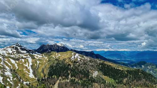 Panoramic view on Frauenkogel (Dovska Baba) with mountain peaks in the Karawanks, Carinthia, Austria. Borders Austria, Slovenia, Italy. Triglav National Park. Mount Triglav and Mangart in the back photo