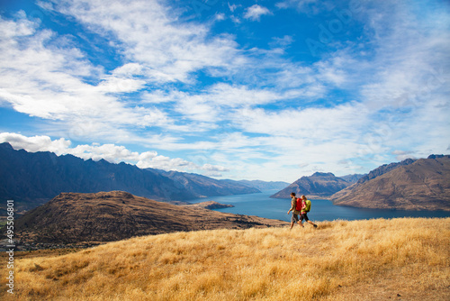 Couple on hiking holiday New Zealand Lake Wakatipu