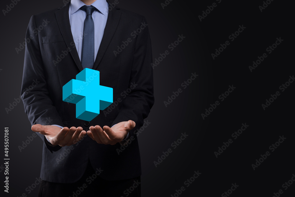 Businessman hold 3D plus icon, man hold in hand offer positive thing such as profit, benefits, development, CSR represented by plus sign.The hand shows the plus sign Businessman hold 3D plus icon, man hold in hand offer positive thing such as profit, benefits, development, CSR represented by plus sign.The hand shows the plus sign