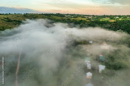 Aerial view drone shot of mountain tropical rainforest,Bird eye view image over the clouds Amazing nature background with clouds and mountain peaks