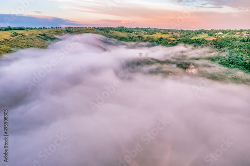 Aerial view drone shot of mountain tropical rainforest Bird eye view image over the clouds Amazing nature background with clouds and mountain peaks