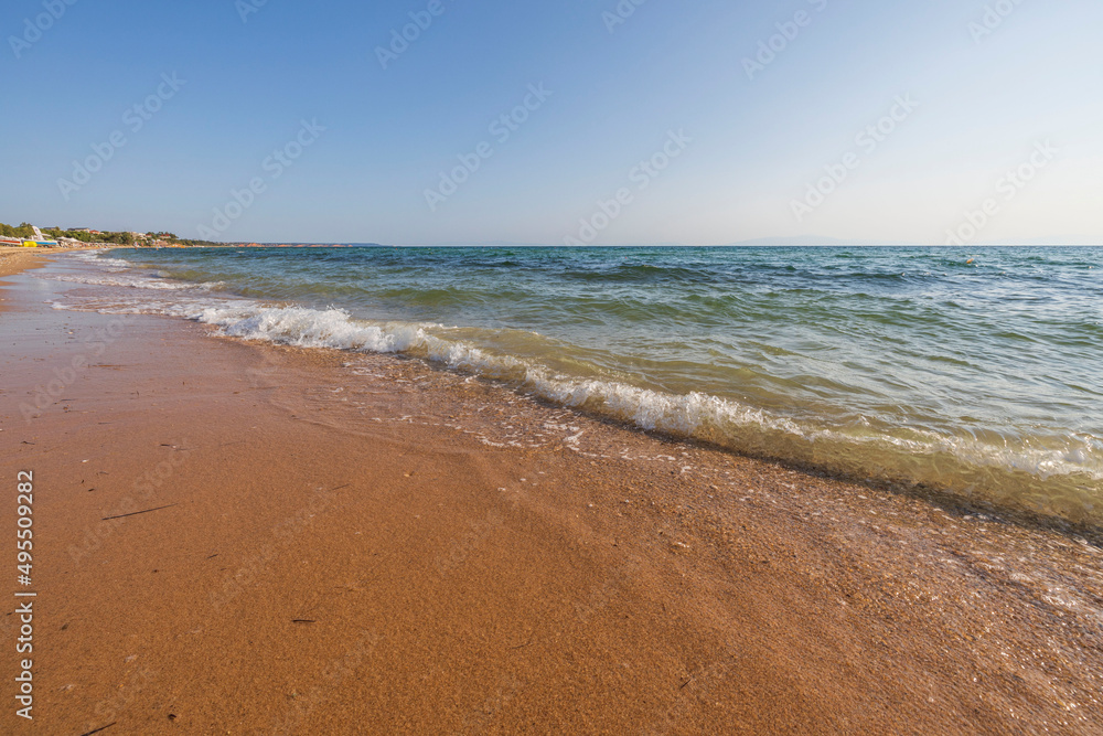 Beautiful view of rolling waves of Mediterranean sea on beach. Greece. Beautiful view of rolling waves of Mediterranean sea on beach. Greece.