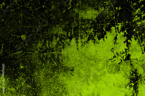 Abstract green painted abandoned concrete wall with dark grunge texture and cracks