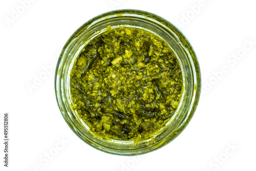 Pesto in glass isolated on white background top view