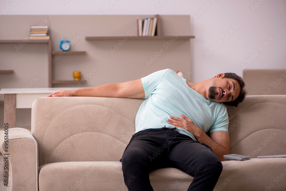 Young man sitting on the sofa Young man sitting on the sofa