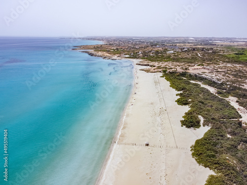 Aerial drone. Beautiful crystal clear water and sandy beach. Cittadella dei Maccari  San Lorenzo  Nature Reserve Oasis of Vendicari  Sicily near Noto.