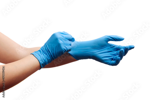 the doctor puts on latex, rubber gloves. Isolated white background