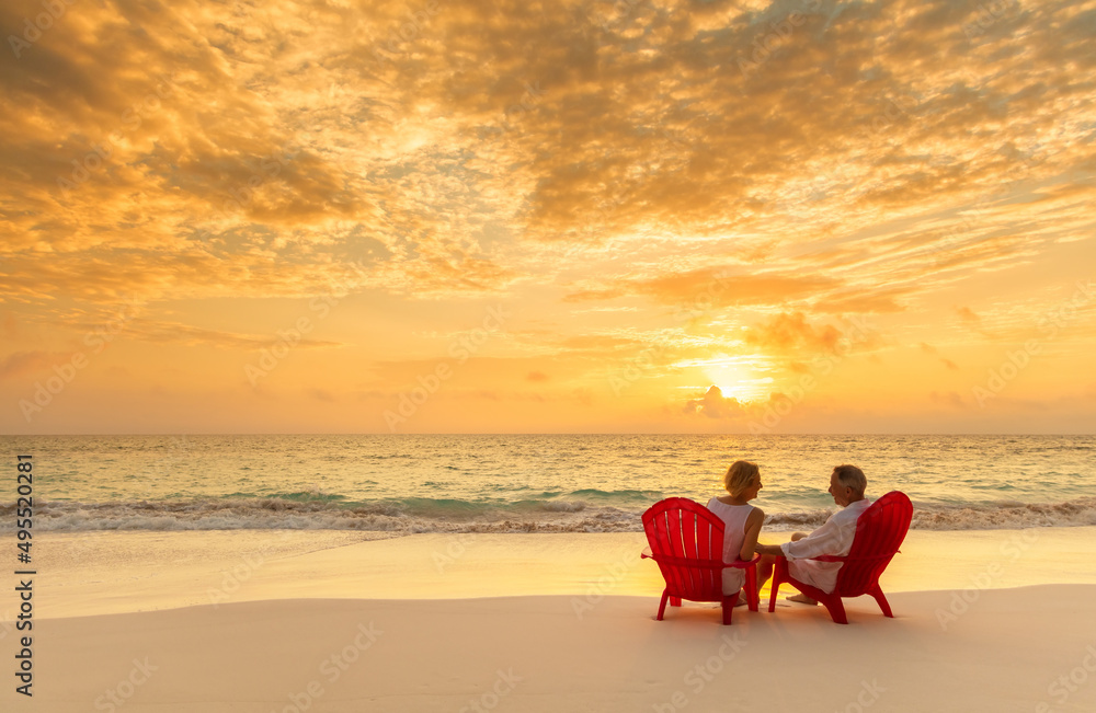 © Spotmatik - Senior couple enjoying beach vacation at sunset Bahamas © Spotmatik - Senior couple enjoying beach vacation at sunset Bahamas