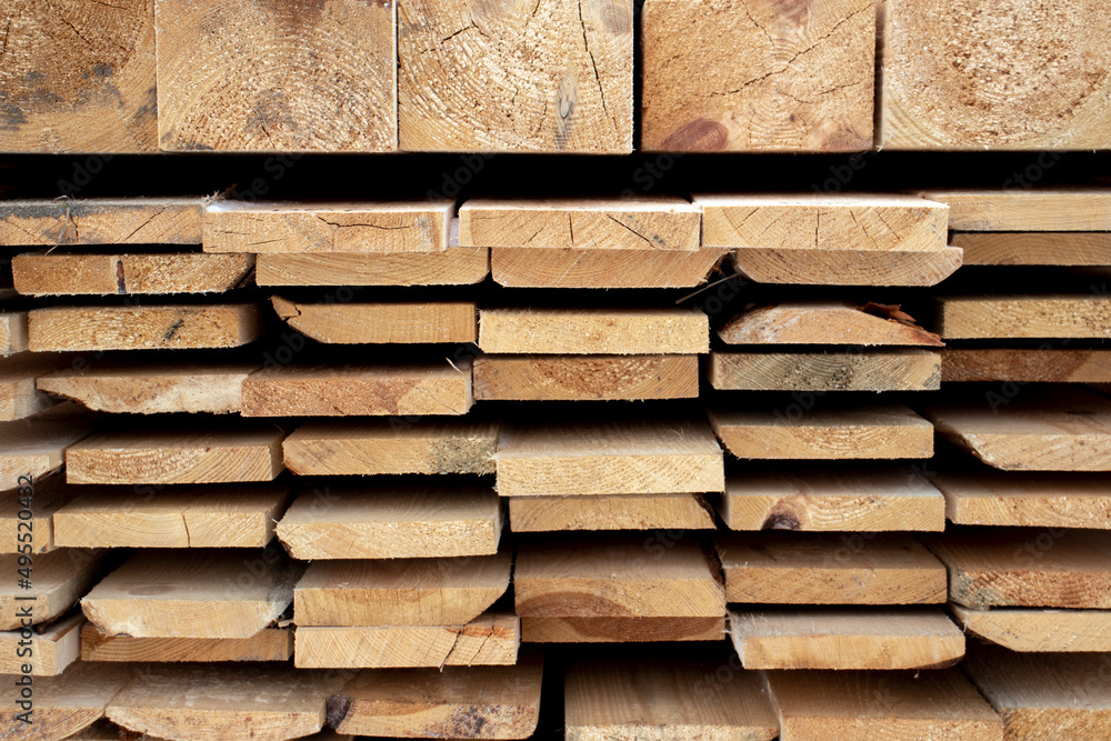 Foto Roughly processed boards lie in a stack