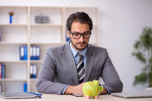 Young male employee in planning retirement concept