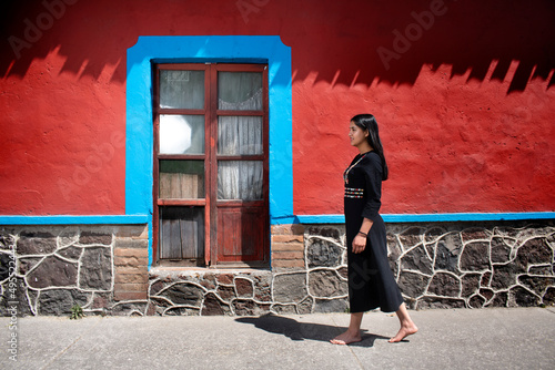 Sensual young latin woman posing in mexican town