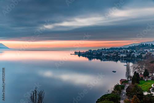 Reflex of the sky during beatiful sunset by the lake with the Alps in the background at Montreux Switzerland