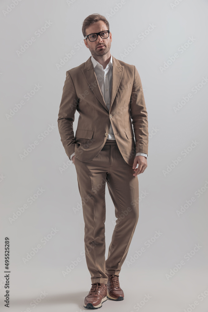 businessman with cool vibe posing with one hand in pocket businessman with cool vibe posing with one hand in pocket