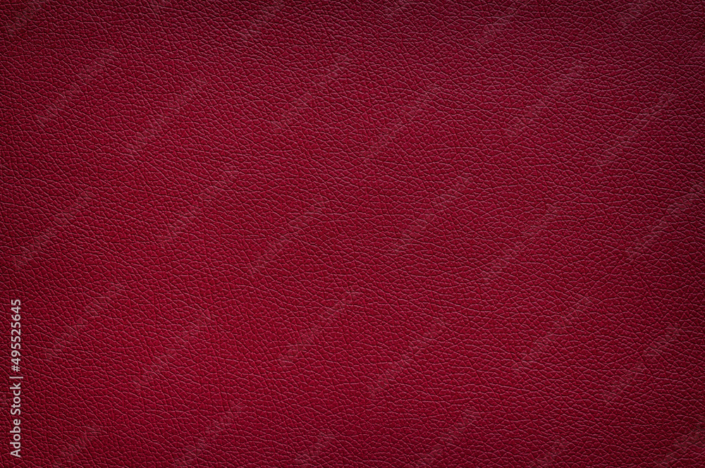 Fototapeta premium The texture of the mahogany red leather, vignette.