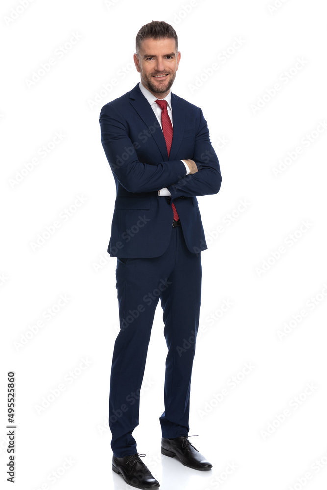 businessman crossing his arms, smiling at the camera businessman crossing his arms, smiling at the camera
