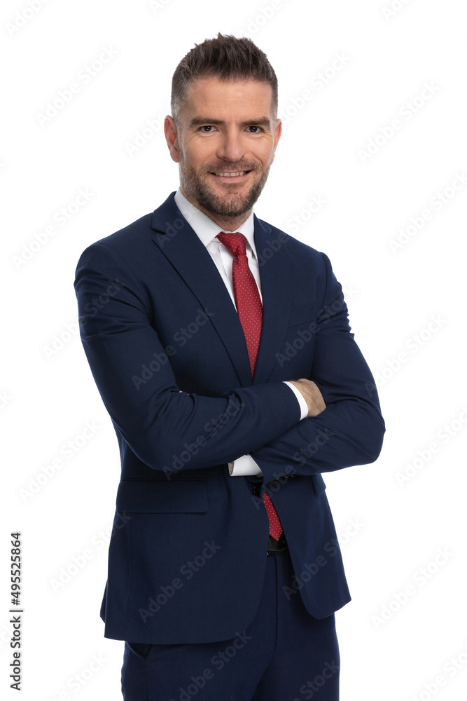 businessman in navy suit is crossing his arms businessman in navy suit is crossing his arms