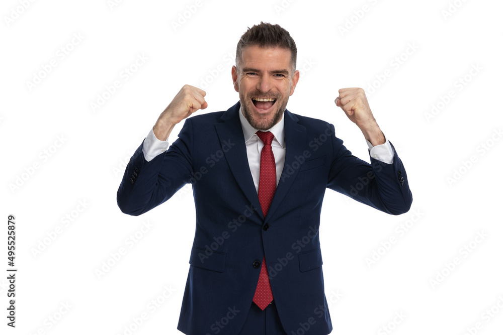 businessman feeling thrilled for the victory he achieved businessman feeling thrilled for the victory he achieved