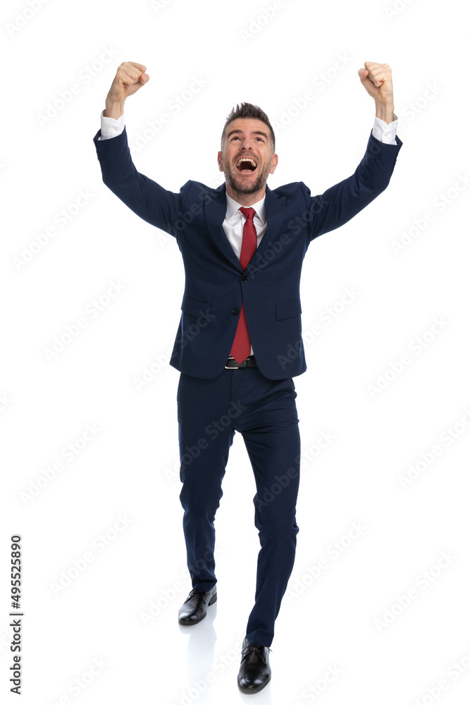 sexy businessman feeling excited and celebrating success sexy businessman feeling excited and celebrating success