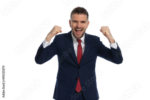 businessman feeling thrilled for the victory he achieved