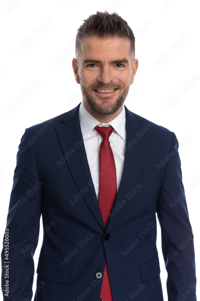 businessman smiling at the camera and wearing a navy suit businessman smiling at the camera and wearing a navy suit