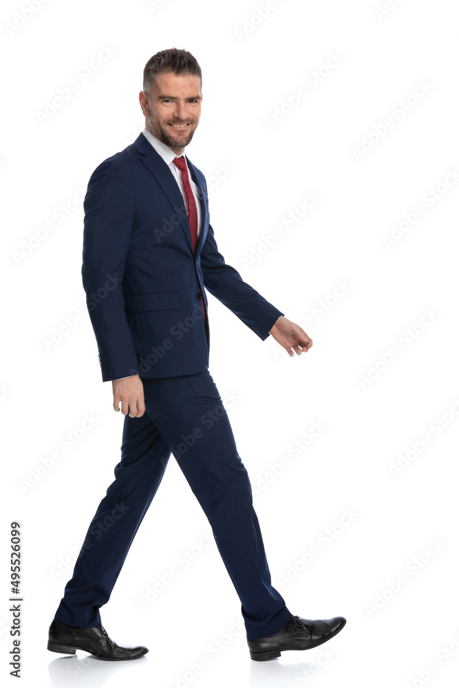 businessman walking to the side with a smile businessman walking to the side with a smile