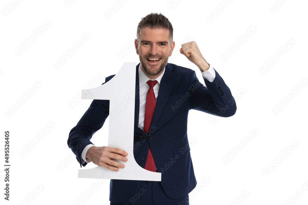 businessman celebrating the fact that he's number one businessman celebrating the fact that he's number one
