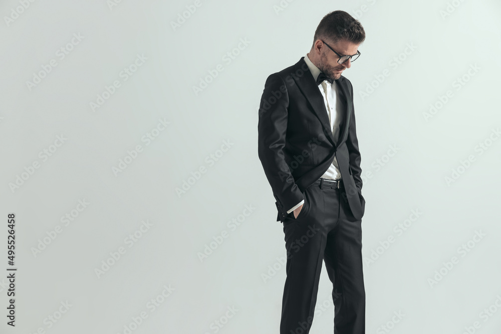 attractive businessman looking down and being dramatic attractive businessman looking down and being dramatic