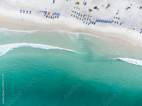 Arraial do Cabo, Rio de Janeiro, Brazil - red sunrise of wonderful paradise beach with white sands and turquoise water - drone view.