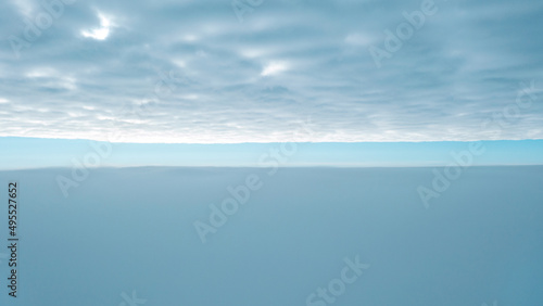 View of the sky above the clouds, beautiful sky background. photo between clouds with a small gap of blue sky
