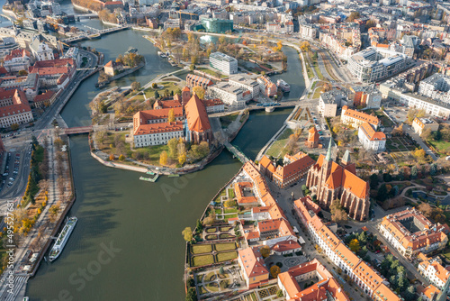 Panorama of the city from a height, a large river flow between the islands in the city of Wroclaw, many bridges, the ancient city center, Poland