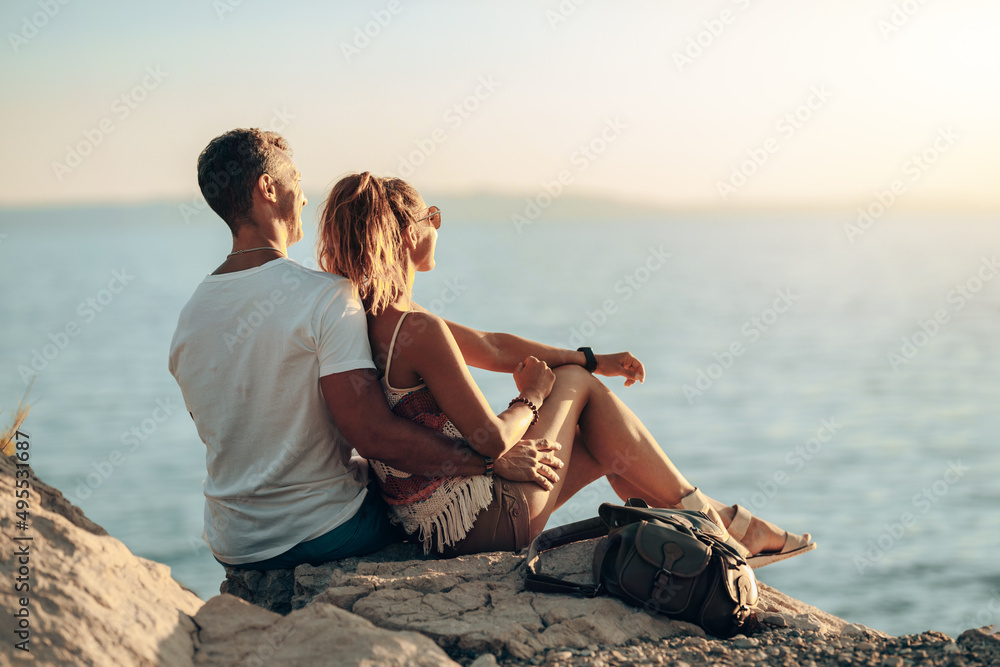 Couple In A Hug Enjoying A Summer Vacation At The Beach