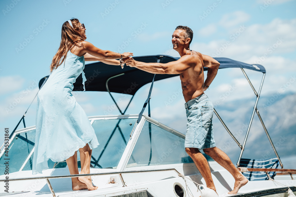 Couple Enjoying Day On Private Yacht Couple Enjoying Day On Private Yacht