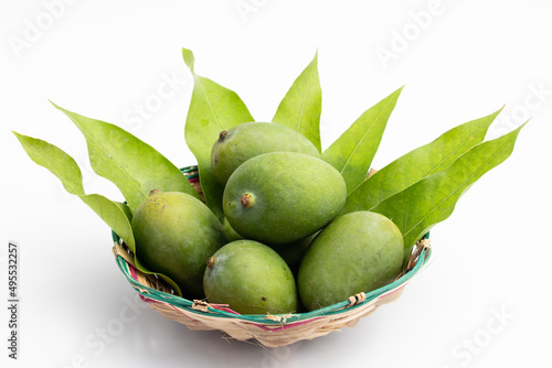 Wallpaper Mural Closeup Of Fresh Raw Green Mangoes Also Called Kacha Khatta Aam With Leaves In Bamboo Basket. Isolated On White Background With Copy Space Torontodigital.ca
