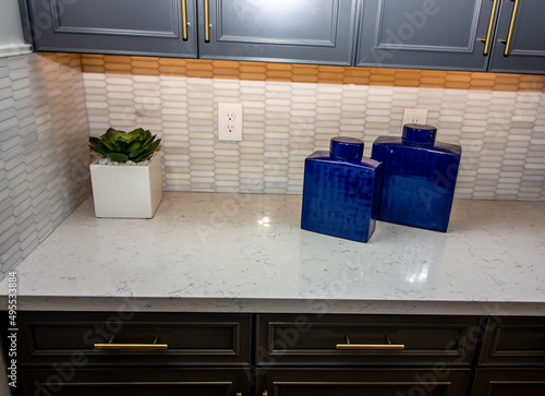 Kitchen Counter Top With Backsplash And Blue Ceramic Containers