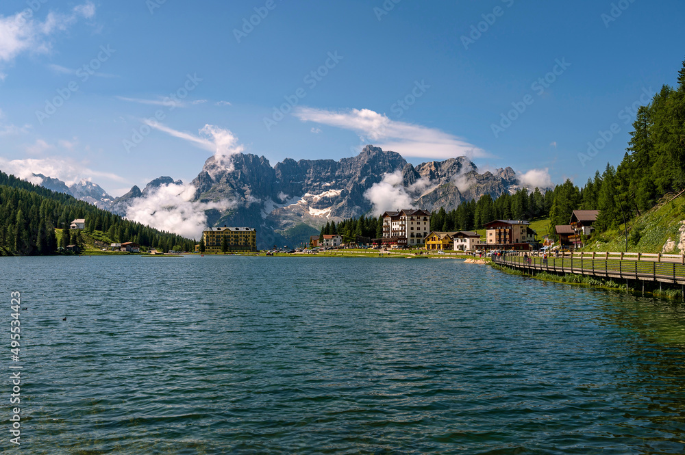''Lago di Misurina'' Lake in Italian Alps, Dolomites..Sunny summer day with blue sky and green forest in foreground.