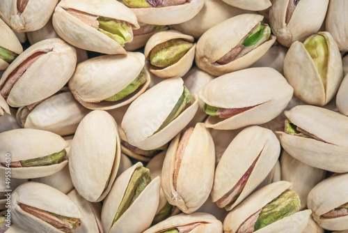 Pistachios texture and background. Tasty pistachios close up. Top view. Flat lay