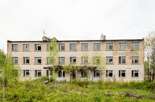 Abandoned white brick multistorey houses. Forgotten, abandoned ghost town Skrunda, Latvia. Former Soviet army radar station.